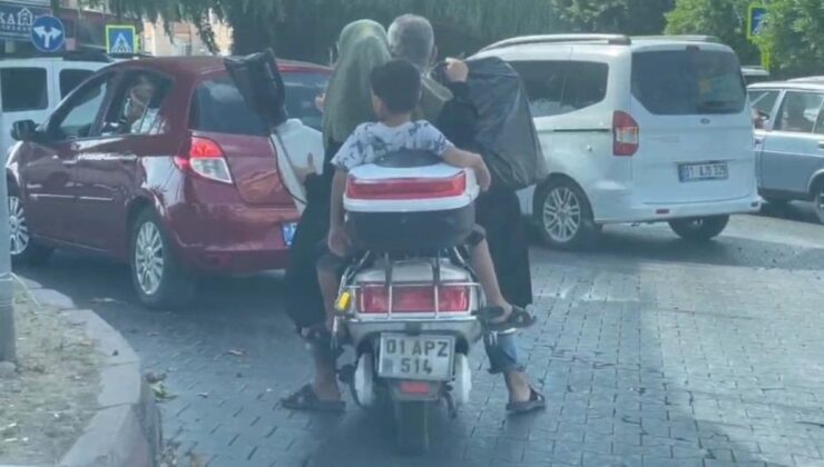 Adana’da motosikletle halı yıkama makinesi taşıyan aile