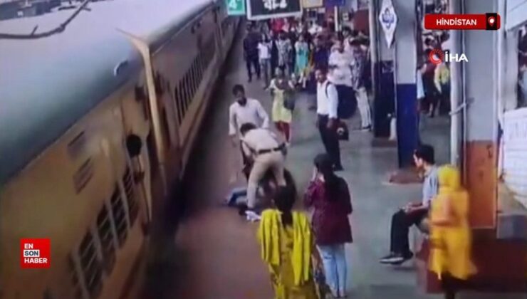 Hindistan’da hareket eden trene binmeye çalışan bayan ezilmekten kıl hissesi kurtuldu