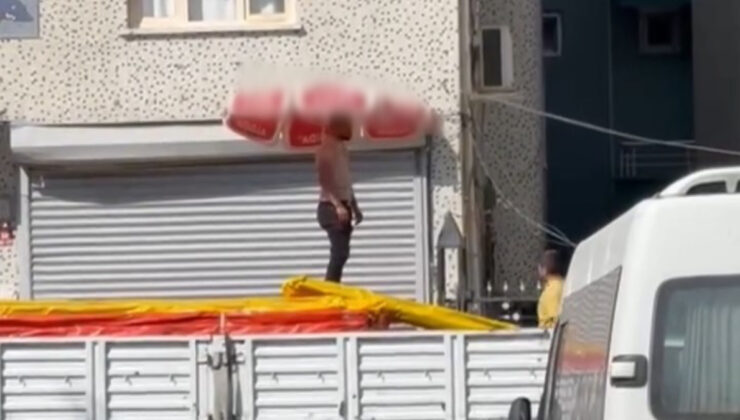 Şırnak’ta kavurucu sıcaktan beline bağladığı plaj şemsiyesiyle korunmaya çalıştı